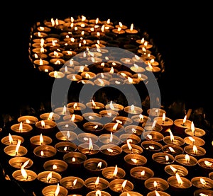 Candles lit with the warm flame during the religious ceremony