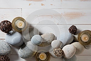 Candles and mineral pebbles for mindfulness or serenity, flat lay