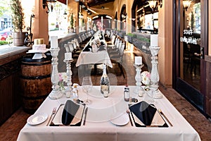 candles, napkins, and glassware on a table