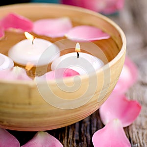 Candles and rose leaves