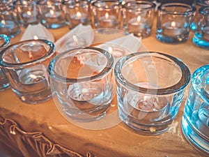 Candles in small glasses and boats during the vigil ceremony and prayer