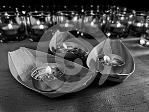 Candles in small glasses and boats during the vigil ceremony and prayer