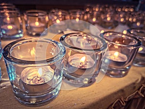 Candles in small little glasses during the vigil ceremony and prayer