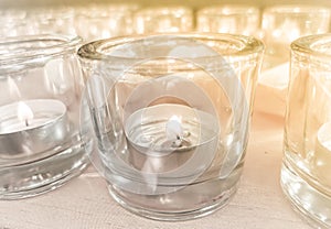 Candles in small little glasses during the vigil ceremony and prayer