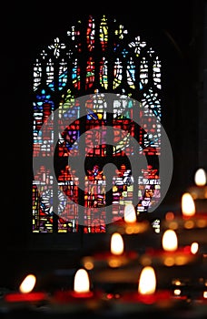 Candles and stained glass in the church