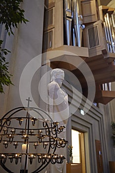 Candles and Statue By Pipe Organ Of Hallgrimskirkja Church In Reykjavik