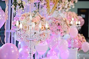 The candlesicks and balloon decorate in backdrop wedding