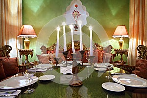 Candlestick with candles at table with serving