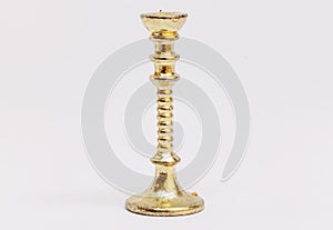 A candlestick in gold for a dollhouse