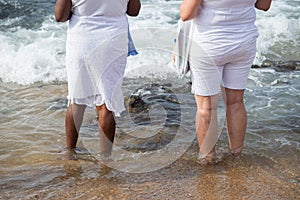 Candomble fans are seen paying tribute during a party for iemanja on Rio Vermelho beach, in the city of Salvador, Bahia