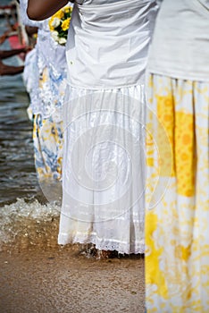 Candomble members are paying tribute to Iemanja during a party on Rio Vermelho beach. Salvador, Bahia