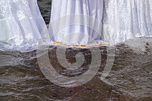 Candomble people are seen entering the sea water to honor iemanja during a party on Rio Vermelho beach. Salvador, Bahia