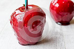 Candy Apples on white wooden surface. Ready to Eat