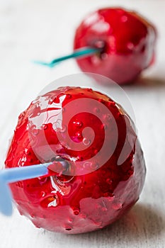 Candy Apples on white wooden surface. Ready to Eat