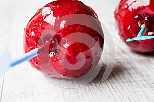 Candy Apples on white wooden surface. Ready to Eat