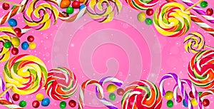 Candy background. Candies on a pink background.