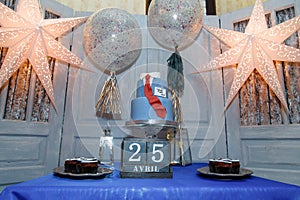 Candy bar with balloons, birthday cake with suit and tie design for a teenage boy, the Russian inscription reads Create Yourself.
