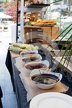 Candy bar food buffet by the pool, during hotel brunch, catering ,Chef live pancakes cooking station