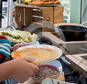 Candy bar food buffet by the pool, during hotel brunch, catering ,Chef live pancakes cooking station