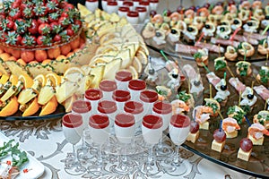 Candy bar with fresh summer fruits prepared for reception
