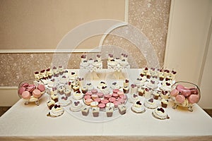 Candy bar. Table with sweets, candies, dessert and cupcakes