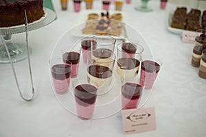 Sweet candy bar.Different delicious fruits and cookies on wedding reception table with bananas and grapes photo