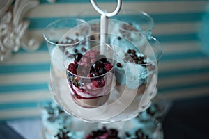 Sweet candy bar.Different delicious fruits and cookies on wedding reception table with bananas and grapes photo
