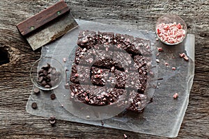 Candy Cane Chocolate Brownies Cut in Squares on Rustic Wood Background