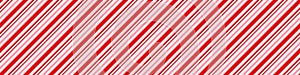 Candy cane Christmas background, peppermint diagonal stripes print seamless pattern photo