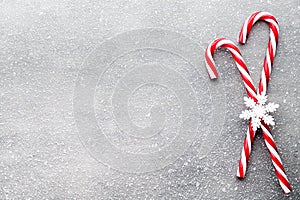 Candy cane. Christmas decors with gray background. photo