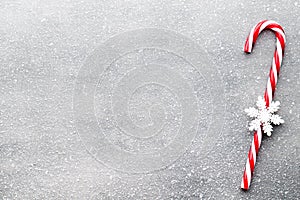 Candy cane. Christmas decors with gray background.