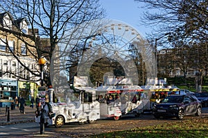 Cane Express Road Train Travelling Down a RoadÂ Offering Complimentary Tourist and Shopper Transportation in Harrogate.