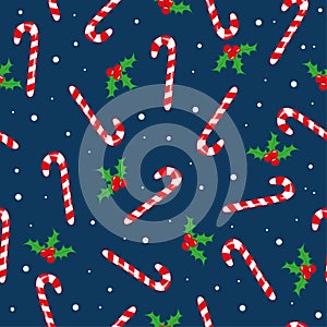 Candy Cane and mistletoe seamless pattern on darkblue backgound.