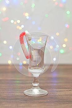 A candy cane used as a decoration in a shooter glass