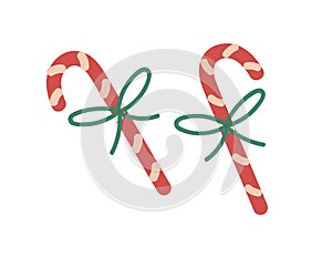 Candy canes. Christmas peppermint sticks, sweet Xmas dessert. Holiday confection, striped candycane with string bow