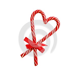 Candy canes heart red ribbon bow isolated white background. Christmas New Year decoration