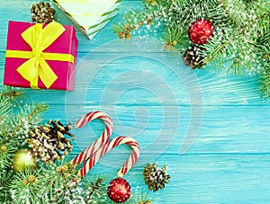Candy, Christmas branch, vintage celebration frame decoration border present snow gift box on a blue wooden background present