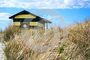 Candy coloured beach hut on Skanor beach in Falsterbo, Skane, Sweden. Swedish tourism concept