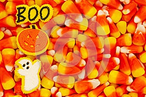 Candy corn, ghost, pumpkin, and boo Halloween background