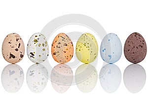 Candy covered Easter eggs in a line