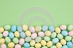 Candy Easter egg background green paper