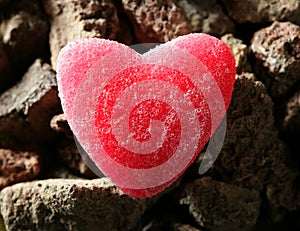 Candy jelly read heart over stones