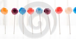Candy lollipops arranged in a horizontal row