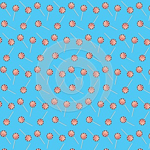 Candy lollipops seamless pattern illustration on blue background. Red lollipop background. Sugar candy lollipops isolated on blue.