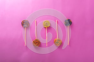 Candy lollipops, sweet lollies isolated on pink background