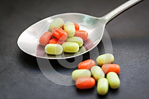 Candy in metal spoon.