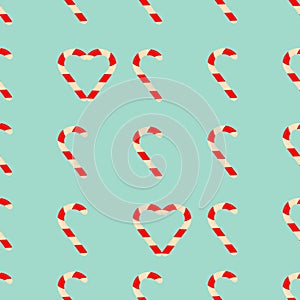 Candy pattern of striped caramels on a turquoise background.