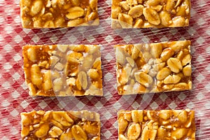 Candy with peanut: Pe de Moleque in Brazil and Chikki in India. photo