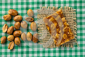 Candy with peanut: Pe de Moleque in Brazil and Chikki in India. photo