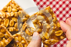 Candy with peanut: Pe de Moleque in Brazil and Chikki in India. photo